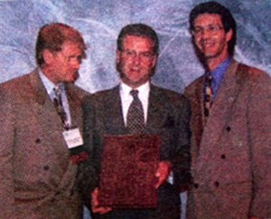 Dr. Greg Dunn receives an award.