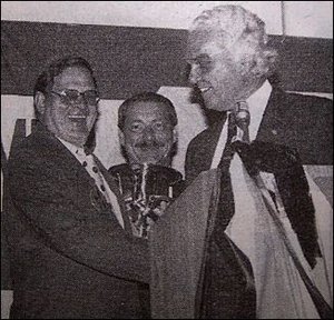 Dr. Holmberg receiving an Award from Dr. Williams.