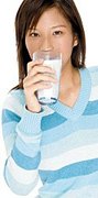 Woman drinking glass of milk.
