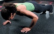 Chelsea Cooper performing pushup.