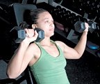 Chelsea Cooper performing incline dumbbell chest press.