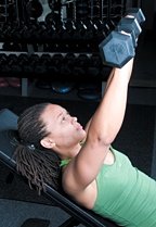 Chelsea Cooper performing incline dumbbell chest press.