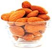 Small glass bowl of Almonds.