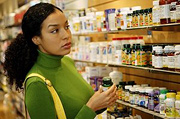 Woman shopping for supplements.