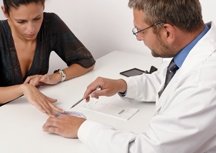 A woman and her doctor discuss her medication.