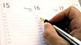 A calendar being written on.