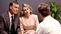 A man and wife consult with their doctor.