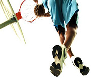 Man dunking a basketball.