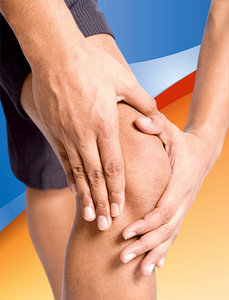 Man clutching at his injured knee.