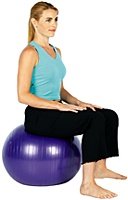 Woman sitting on exercise ball.