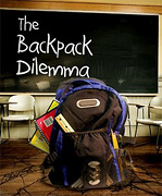 Backpack stuffed full of school supplies in classroom.