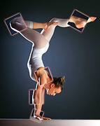 Female gymnast performing handstand.