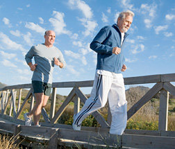 Father and son running at the beach.