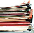 A stack of bindered studies.