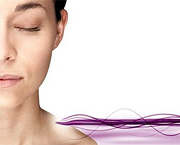 Woman with illustrated sonic waves touching her shoulder.