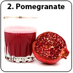 A glass of pomegranate juice and half a pomegranate.